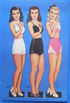 three women in bathing suits standing next to each other with their hands on their hips