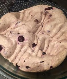 a chocolate chip cookie sitting on top of a glass plate