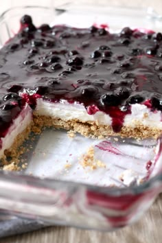 a blueberry cheesecake in a glass dish