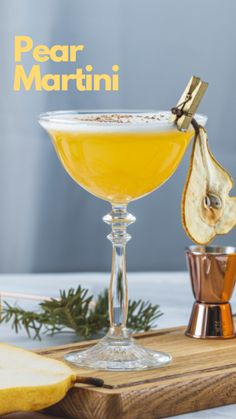 the pear martini is garnished with an apple slice and cinnamon on a cutting board