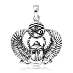 an egyptian scarp with the eye on it and wings around it, hanging from a silver