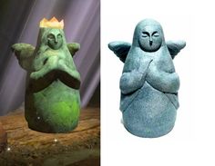 there are two statues that look like they have crowns on their heads and arms, one has an egg in the shape of a bird