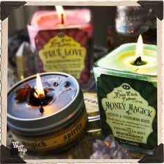 three candles sitting next to each other on a table