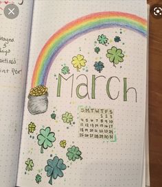 an open planner with shamrocks and a pot of gold on the cover, which reads march