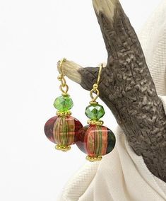 Lightweight Red and Green Acrylic Beaded Christmas Earrings. The bottom bead is acrylic and has a pretty blend of reds and greens. They almost seem to change color positions as the bead moves around. Very unique. The top bead is a green glass, faceted crystal.  The ear wires and post are gold plated brass that is nickel and lead-free.  A fun affordable pair of earrings for the Christmas and Holiday season. Give them as a gift or keep them for yourself. Each pair of my earrings comes with a soft, Holiday Colors, Holiday Jewelry, Colorful Party, Christmas Earrings, Green Earrings, Faceted Crystal, Green Christmas, Jewelry Party, Acrylic Beads