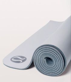 the yoga mat is rolled up and ready to be used as a mat for exercise