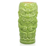 a green ceramic vase with an angry face on the front and bottom, sitting on a white surface