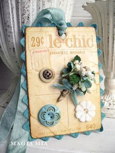 a card with buttons and flowers on it