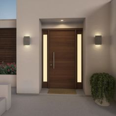 a modern entrance with two planters and lights