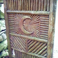 an old wooden door with the letter c carved into it