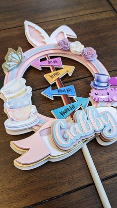 a cake topper with the name cadby on it