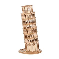 a small model of the leaning tower of pisa on a white background with clippings