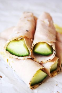 an image of some food that is on the screen and it looks like they have cucumber slices cut in half