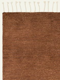 a brown rug with white lines on it