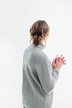 This lapped-front turtleneck pullover in Shaker rib effortlessly blends comfort and simple style. The boxy silhouette is offset by the inverted V of the open fronts, which grow gradually through decorative increases within the rib structure until they cross over the heart. Modified drop sleeves complete the roomy fit. The back, front, and sleeves are knit flat and seamed, with the circular collar worked from stitches picked up through both fronts to unite them. The Shaker rib is crisply defined Sweater Handmade, Brooklyn Tweed, Turtleneck Pullover, Bind Off, Pullover Designs, Slow Fashion, Front Open, Simple Style, Hand Knitting