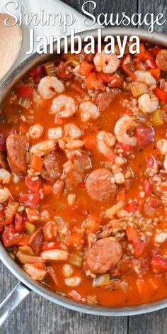 shrimp sausage jambalya in a pot with spoons