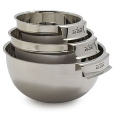 four stainless steel bowls stacked on top of each other with the names air chef written on them