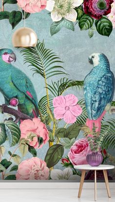 two parrots sitting on top of flowers in front of a wallpapered mural