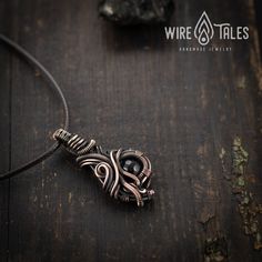 Wire wrapped bohemian style copper necklace pendant with natural black Onyx gemstone. Copper was oxidized to create antique look and to highlight the details of the wire work. It is a unisex necklace so it fits both men and women. This copper necklace comes with brown waxed cotton cord which has adjustable sliding knot and it can easily be adjusted to your preferred length ( approximately from 12 to 24 Inches). This necklace was made out of natural copper wire, so it is going to get darker over Adjustable Hand Wrapped Copper Crystal Necklaces, Adjustable Hand Wrapped Copper Crystal Necklace, Adjustable Copper Crystal Necklace With Natural Stones, Black Bohemian Crystal Gemstone Necklaces, Black Bohemian Crystal Necklace With Gemstone, Black Bohemian Crystal Gemstone Necklace, Artisan Wire Wrapped Black Jewelry, Adjustable Hand Forged Black Jewelry, Artisan Black Wire Wrapped Jewelry