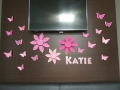 there is a wall with pink butterflies and the name kate on it