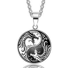 Yin and Yang have long been revered as a symbol for balance. This symbol has been further enhanced with the addition of 2 majestic dragons on the front portion of this piece. The accessory is a stainless steel pendant plated with a black and white paint embossed lightly over the top to create the top design. Carrying both a black and white dragon against contrasting colors of the symbol, you'll find the piece nicely balanced. The lovely pendant is a simple round piece that can comfortably lay flat against your chest or neckline. Wearable as either a choker or long-form necklace, this Innovato Design product has an adjustable chain link included.  Product Highlights:    Simple and Lovely Pendant Design  Long Chain Link included (24")  Made of Stainless Steel Material Yin Yang Dragon, Tiger Pendant, Trending Necklaces, Natural Stones Necklace, Mens Jewelry Necklace, Unisex Necklace, Dragon Pendant, Ying Yang, Hip Hop Jewelry