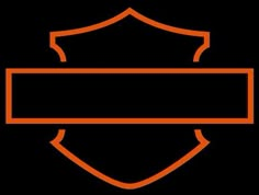 an orange and black sign with a shield on it's side in the dark