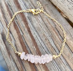 Genuine raw rose quartz bracelet in gold or silver. Dainty and delicate romantic and soft. Rose Quartz is the stone of universal love. It restores trust and harmony in relationships, encouraging unconditional love. Rose Quartz purifies and opens the heart at all levels to promote love, self-love, friendship, deep inner healing and feelings of peace. It draws in love, romance, and attraction. It sure is a feminine stone that works well for every women. Normal bracelet length is 7 inches. Options: Pink Crystal Bracelet With Stones As Gift, Dainty Rose Quartz Bracelets With Natural Stones, Dainty Rose Quartz Healing Bracelet, Pink Gemstone Bracelet, Raw Stone Bracelet, Elegant Hand-strung Rose Quartz Crystal Bracelet, Crystal Mobile, Hand-strung Rose Quartz Crystal Bracelet For Healing, Adjustable Rose Quartz Stretch Bracelet, Spiritual Style