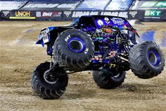 a monster truck is in the middle of an obstacle course