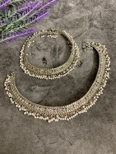 Bridal Antique payal set (pair). Brass made very flexible . Clear reverse polki and bell . About 9 inch long each and 4.5 inch closed. Traditional Oxidized Wedding Anklets, Traditional Oxidized Anklets For Wedding, Traditional Wedding Anklets With Oxidized Finish, Festive Metal Anklets With Latkans, Silver Wedding Anklets With Latkans, Festive Silver Anklets For Puja, Festive Silver Beaded Anklets For Festivals, Festive Metal Anklet With Silver Beads, Traditional Oxidized Anklets For Festive Season