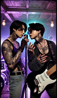 two people with tattoos and piercings are singing into a microphone