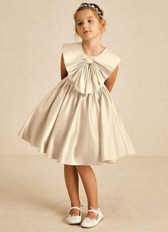 Poppet showcases a lovely A-line silhouette in smooth matte satin. With a charming scoop neckline and sleeveless design, it offers effortless elegance, complete with a convenient zipper closure for easy wear. Perfect for any special occasion! Winter Flower Girl Dress, Champagne Flower Girl Dresses, Satin Flower Girl Dresses, Winter Flower Girl, Champagne Flower Girl, Flower Girl Dresses Champagne, Satin Flower Girl Dress, Military Ball Dresses, Sage Dress