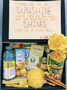 a box filled with lots of different types of food next to a sign that says sunshine shines