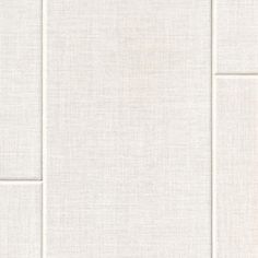 a white tile wall with several squares on it