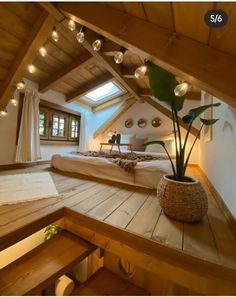 an instagram photo of a bedroom with lights on the ceiling and wooden flooring