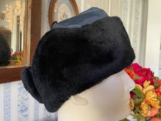 The outside of this trapper hat is made of dark blue weatherproof fabric and trimmed with warm, soft black mouton on the brim and inside of the ear flaps. It has a quilted fabric lining. Made by Peter Gay and Sons Ltd. and marked size 7 1/2. In very good condition. Fur Hat Black, Trapper Hat, Trapper Hats, Quilted Fabric, Vintage Fur, Fur Hat, Hat Cap, Soft Black, Fur Trim