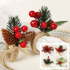 two pine cones with red berries on them are sitting on a plate next to other christmas decorations