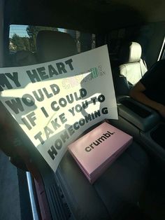 a sign in the back seat of a car that says, my heart would i could't take you to home coming