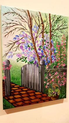 a painting on the wall of a garden with trees and flowers painted on it's sides