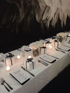 the table is set up with place settings for dinner guests to enjoy their meal together