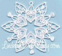 a white snowflake is shown on a light blue background with the word love written in it