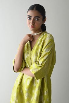 Neon green straight kaftan style tunic with all over floral brocade pattern and side pockets. Paired with a cigarette pant. - Aza Fashions Green Tunic Kaftan For Festive Occasions, Traditional Green V-neck Tunic, Green Tunic Kurta For Spring, Green V-neck Kaftan For Festive Occasions, Spring Green Tunic Kurta, Green Spring Tunic Kurta, Green V-neck Sets For Eid, Green Cotton Silk Kurta For Summer, Designer V-neck Kurta For Summer