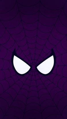 the face of a spider man with eyes glowing in front of it's web