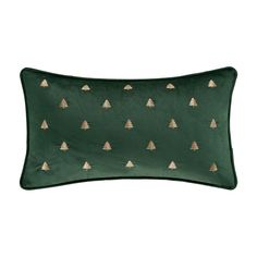 a green pillow with gold trees on it