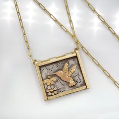 This is a very very special and personal piece! It's going to be hard to let go! ️🌺 Every little feather and detail of this piece was hand cut and forged by me and it took a very long time to create😆! Hummingbirds hold a very special place in my heart. This is a very large and substantial piece with the pendant being 1.125 inches tall and nearly 1.25 inches wide. It's constructed out of extremely thick 14 karat solid yellow gold and the backing is solid sterling silver that is heavily oxidized Hummingbird Necklace, Silver Background, Art Necklaces, Handmade Fine Jewelry, Luxury Necklace, Precious Gems, Hummingbirds, Metal Necklaces, Artistic Jewelry