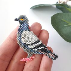 Pigeon PDF pattern is available for purchase. Follow the link in bio.❤️ ............................................................................ Купить схему голубя, вы можете пройдя по ссылке в профиле. Из сплетенного изделия можно сделать брошь, или использовать как декор для сумки, кружки и т.д. #pigeonbeadpattern #кирпичноеплетение #миюки #beadpattern #brickstitchpattern #pigeon #pigeonbroochpattern #pigeonpattern #бисероплетение #miyuki #miyukipattern #miyukibeads #beadedpigeon Brick Stitch Tutorial, Seed Bead Tutorials, Beaded Bird, Pigeon Bird, Art Perle, Brick Stitch Earrings, Bead Weaving Patterns