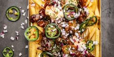 a platter filled with lots of different types of food on top of a table