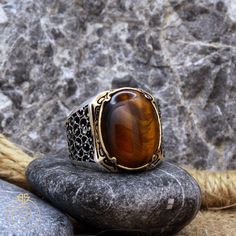 Men's brown tiger's eye statement ring which will give you a head turning presence. This unique, vintage style, engraved 925 Sterling Silver ring has an exquisite design for the polished, refined, and distinguished man. Perfect for casual and formal events, it will make your friends envious as you walk into the room full of confidence and pride and command attention. Looking for a unique, one of a kind GIFT FOR HIM, groomsman gift, father's day gift, teacher day gift? Look no further. This cool Vintage Brown Ring With Polished Finish, Classic Brown Rings With Polished Finish, Collectible Brown Gemstone Rings, Antique Brown Ring Jewelry, Vintage Brown Signet Ring As A Gift, Antique Brown Cabochon Ring, Brown Polished Finish Signet Ring For Anniversary, Brown Polished Signet Ring For Anniversary, Formal Brown Engraved Ring