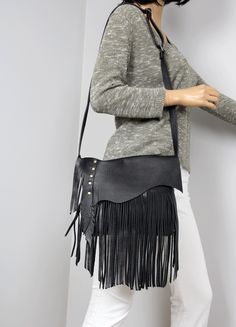 Handmade fringe handbag, Medium Crossbody purse, Unique crossbody bag, Black Bag This black small handmade fringe handbag is perfect for everyday use.  Dimensions: height: 21 cm (6 in)     max width:  27 cm (10.5 in) strap: max 130 cm (51 in) Hobo bag made from genuine first class leather. * Zippered *  Unlined * Includes internal pocket for mobile phone and other small items. Important note: The flap on the bag may slightly differ because of the natural edge of the leather used to sew it. Boho Leather Purse, Unique Crossbody Bag, Fringe Crossbody Purse, Navy Blue Bag, Boho Crossbody Bag, Leather Fringe Bag, Fringe Handbags, Custom Strap, Black Leather Shoulder Bag