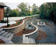 an outdoor patio with stone steps and landscaping