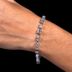 ♦♦ Bracelet  Detail ♦♦ ♦ Main Stone: CZ Diamond/Moissanite ♦ Main Stone Shape: Oval, Asscher, Emerald, Pear, Marquise, Heart, & Round Cut ♦ Total Stone Weight: 12.10 CTW Approx. ♦ Main Stone Color: Colorless ♦ Metal: Sterling Silver, 10K/14K/18K Solid Gold, Or Platinum ♦ Finish Options: Yellow / Rose / White ♦ Free Shipping For the USA ♦ Free Engraving ♦ Nickle Free ✥ P E R S O N A L I S A T I O N ✥ ♦ If you like the ring design to be customized, we will gradually accept your idea and will try to put it into the design. ♦ Choose your ring size while ordering. If the ring size is not listed in the option, then please get in touch with me. ✥ O T H E R ∙ I N F O R M A T I O N ✥ ♦ Your item will be nicely packed to gift in elegant jewelry boxes. ♦ Some pictures show the listed engagement ring Silver Moissanite Tennis Bracelet For Wedding, Silver Moissanite Bracelets For Wedding, Wedding Silver Moissanite Tennis Bracelet, Wedding Diamond Bracelet In Sterling Silver, Sterling Silver Diamond Bracelet With Prong Setting For Wedding, Wedding Sterling Silver Bracelet With Vvs Clarity, Sterling Silver Bracelet With Prong Setting For Wedding, Sterling Silver Wedding Bracelet With Prong Setting, Wedding Diamond Bracelet In Sterling Silver With Vvs Clarity